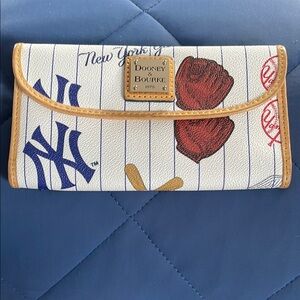 Dooney & Bourke White and Tan Clutch with Sports Theme
